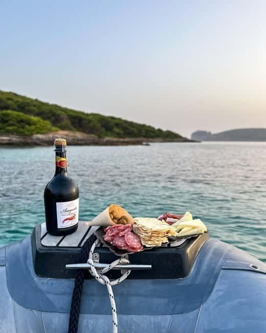 Alghero: boat tour with aperitif at sunset Porto Conte - Key Points