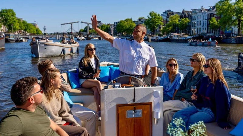 Amsterdam: Canal Cruise in Open Boat with Drink Option - What to Expect During the Cruise