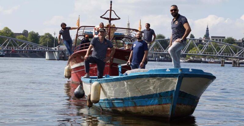 Amsterdam: Canal Cruise on a Wooden Refugee Boat - A Different Kind of Canal Tour