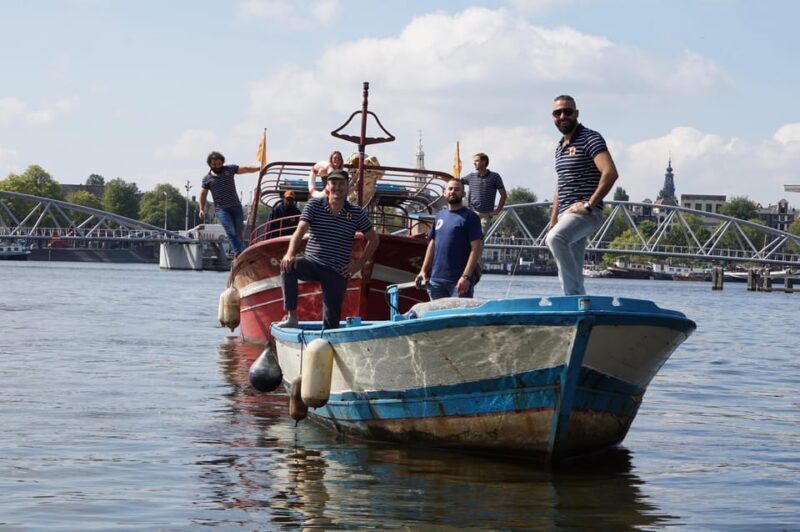 Amsterdam: Canal Cruise on a Wooden Refugee Boat - Authenticity and Engagement