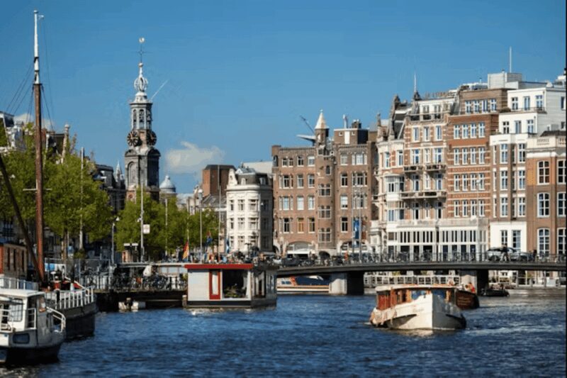 Amsterdam: City Highlights Small Boat Canal Cruise with host - The Sum Up