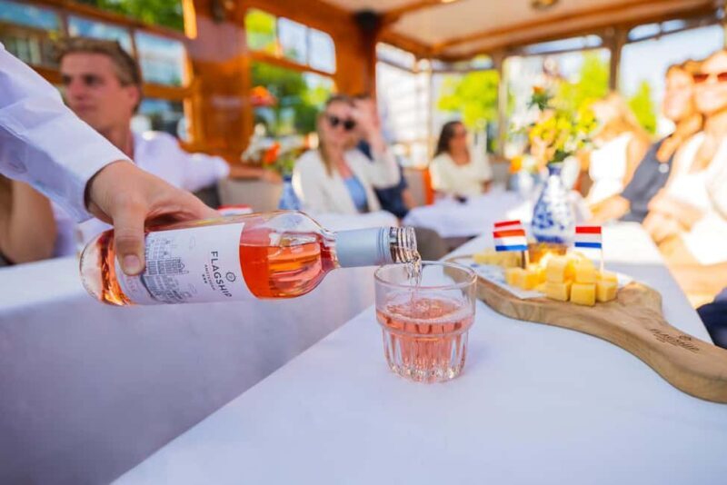 Amsterdam: Classic Saloon Boat Cruise with Cheese & Wine - Sights & Highlights