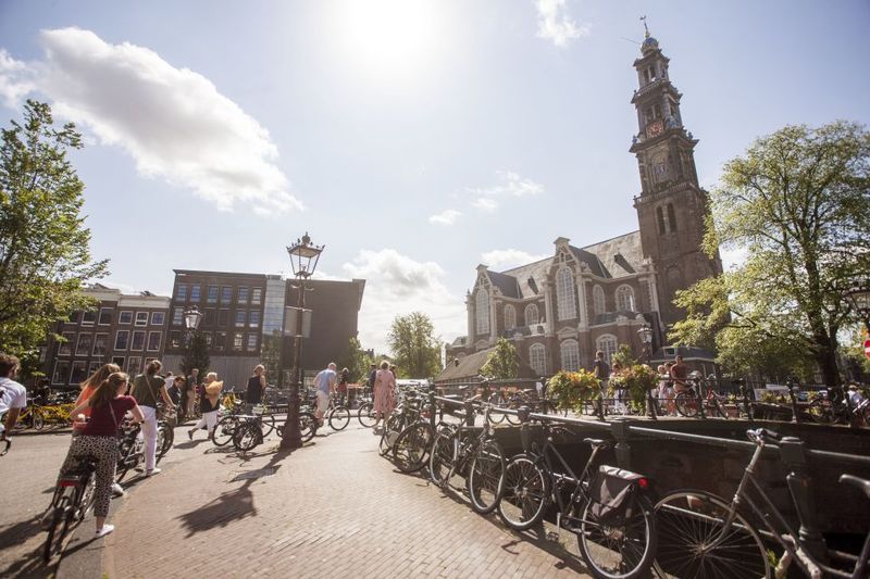 Amsterdam: Hidden Gems & Highlights Guided Bike Tour - Entering Amsterdam by bike: what this tour actually delivers