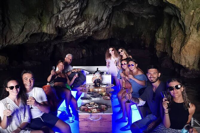 Aperitif on the boat at Sunset island and sea caves - A Closer Look at the Experience