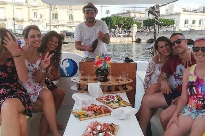 Aperitif on the boat at Sunset island and sea caves - FAQ