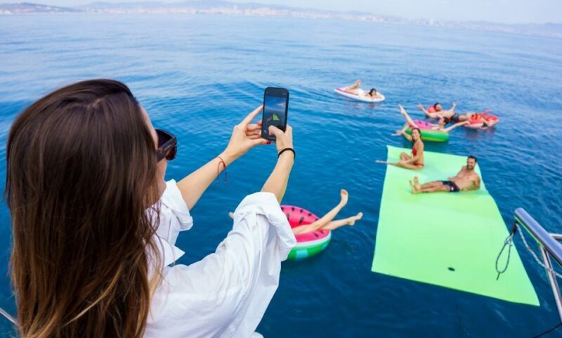 Barcelona: Sunset or Day Catamaran Cruise with Tapa & Drink - What the Experience Looks Like