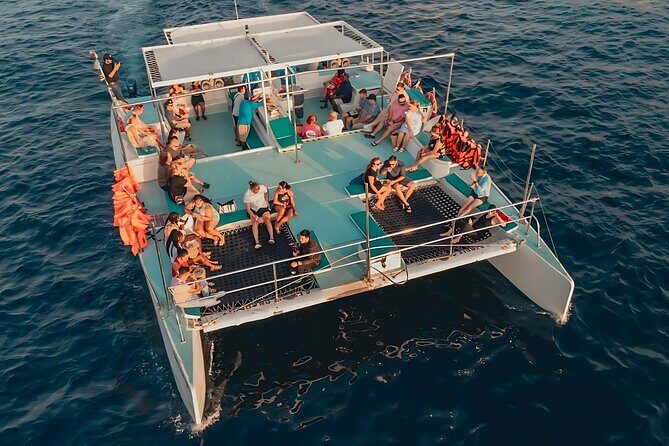 Cabo Catamaran Tour: Snorkeling & Unlimited Drinks Included - Key Points