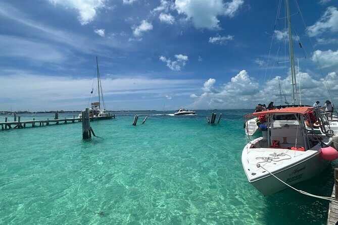 Catamaran Sail with Snorkeling and Beach Club of Isla Mujeres - Cruising to Isla Mujeres: Relaxation on the Water
