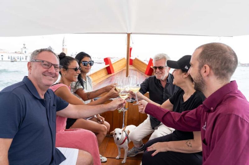 Check out Venice from a different angle: a scenic tour on a traditional boat. - The Sum Up