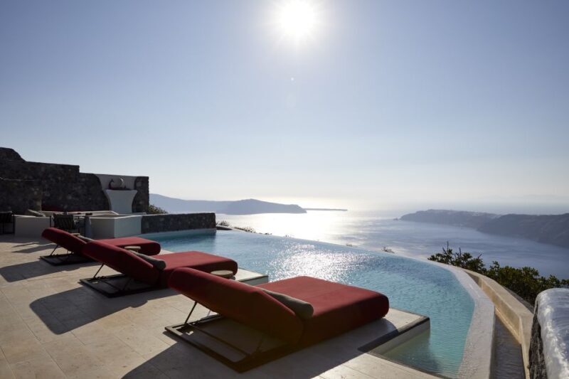 Daybed Relaxation with infinity pool use with caldera views - The Experience in Detail