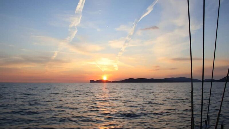 From Alghero: sunset on a sailing boat with aperitif - Swimming Under the Stars