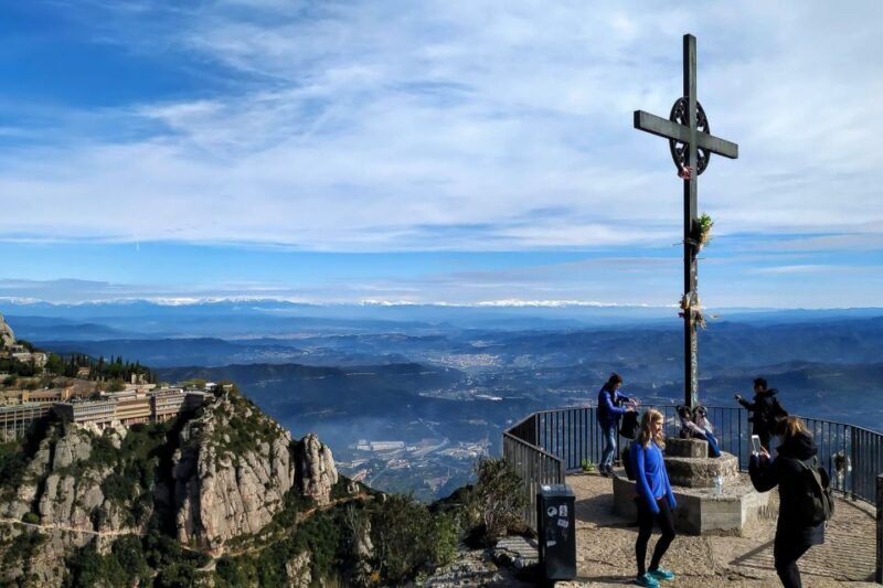From Barcelona: Montserrat Mountain Hike and Monastery Tour - Enjoying Catalan Snacks and Scenic Descents