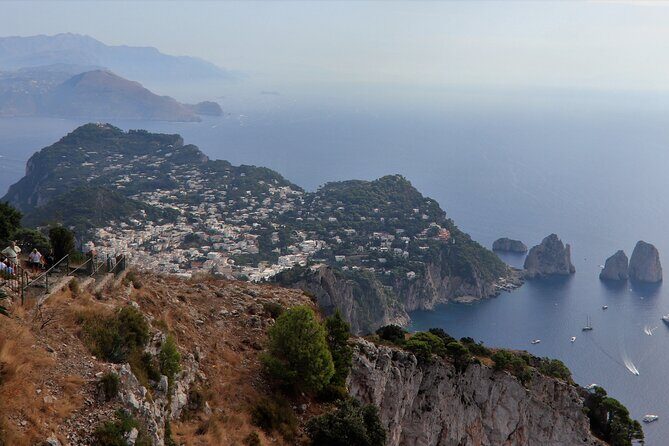 From Capri Guided Tour with Faraglioni and Grottoes Visit - Key Points