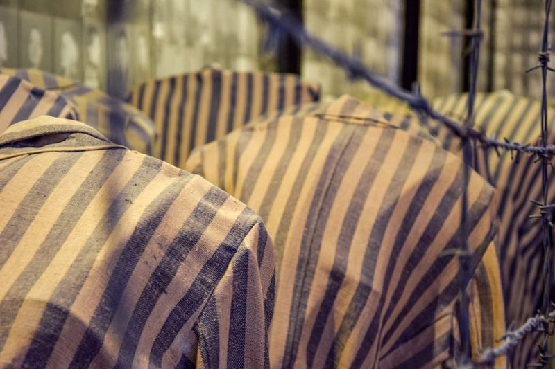 From Krakow: Auschwitz-Birkenau Full-Day Guided Tour - Entering Auschwitz I: Gate, Barracks, and the Shape of the Camp