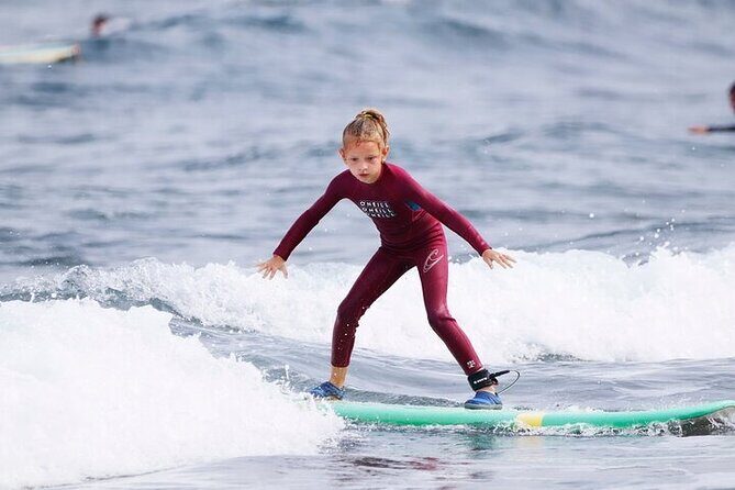 Group Surf Class in Playa de Las Américas with Photographs - Warm-Up and Water Practice