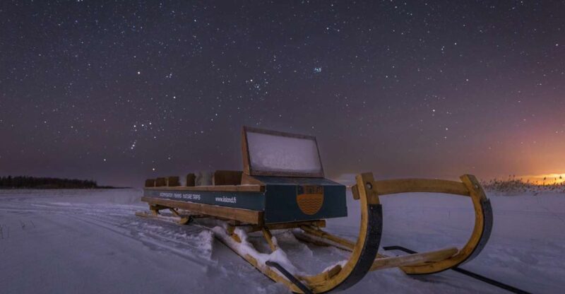 Ii: Snowmobile sleigh trip on frozen sea under starlit sky - Key Points