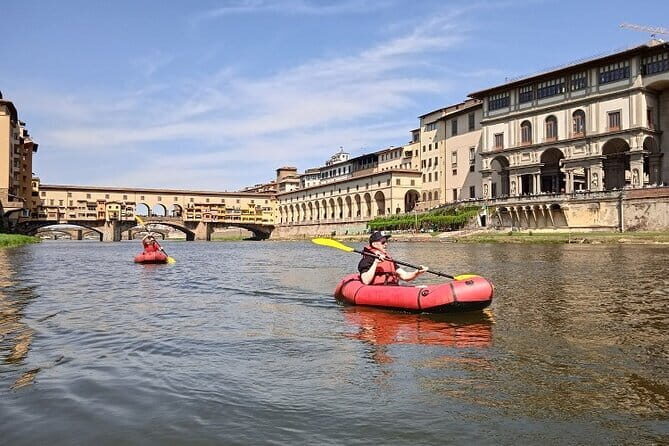 Kayak on the Arno river in Florence under the arches of the Old Bridge - The Sum Up