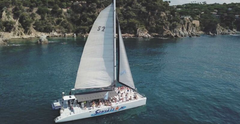 Lloret de Mar: Sunset Catamaran Cruise with DJ and Drinks - Setting Sail in Lloret de Mar