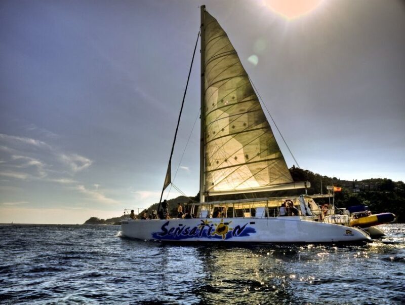 Lloret de Mar: Sunset Catamaran Cruise with DJ and Drinks - The Experience