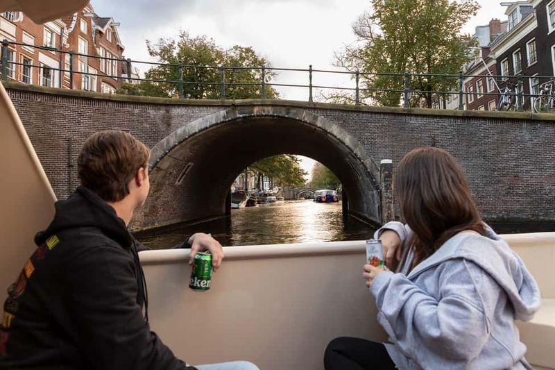 Discover Amsterdam: Luxury Canal Cruise with a Local Skipper - Drinks and photos: simple onboard rules