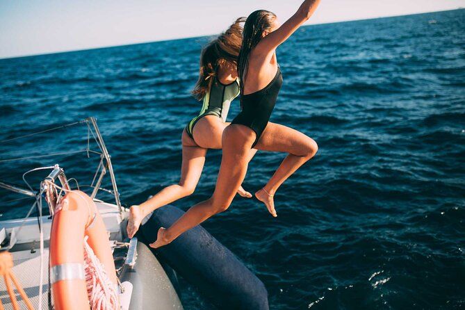 Luxury Catamaran Cruise with Brunch and Unlimited Drinks - Whale and dolphin watching: great when it happens, not promised