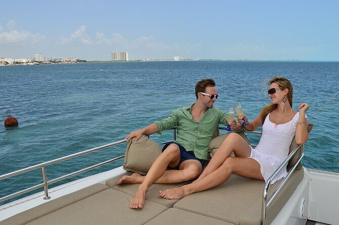 Luxury Catamaran to Isla Mujeres + Private Beach Club with Open Bar - Returning to Cancun: Sunset and Reflection