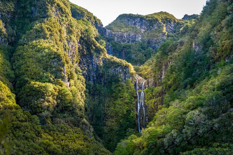 Madeira: Enjoy a Guided Levada Walk in the Rabaçal Valley - The lagoon and cliffbase: what it feels like up close