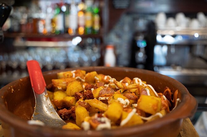 Madrid by Night: Tapas Crawl, Local Drinks & Hidden Gems - Puerta del Sol Finish: Dessert Near an Iconic Landmark