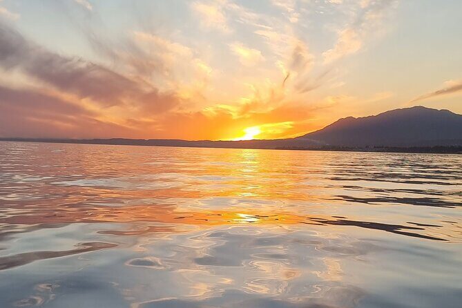 Marbella- sunset from a sailboat with drinks - Key Points