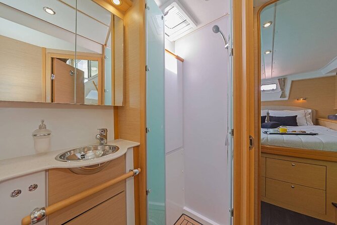 Mykonos Catamaran Premium Day-Sunset Tours 8-flavor Meal & Drinks - Swim and snorkel: the unspoiled cove moment