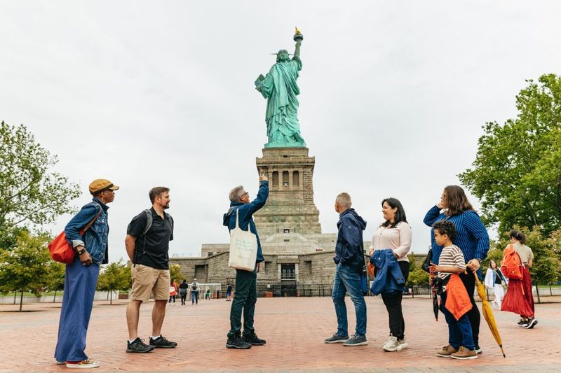 NYC: Statue of Liberty and Ellis Island Guided Tour - Liberty Island Guided Time: The Meaning Behind the Icon