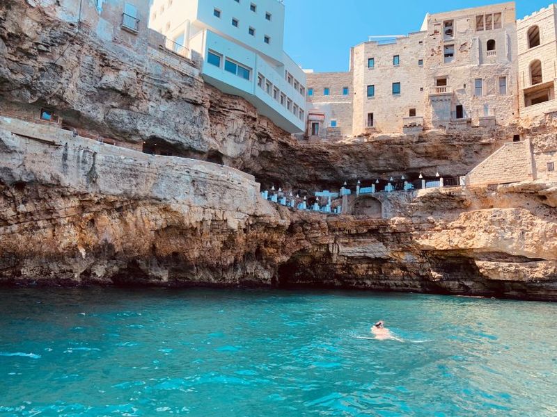 Polignano a Mare: Cave Boat Tour with Aperitif - Swimming in Hidden Coves: Ladders, Floats, and the Wet Reality