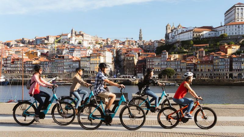 Porto: City Highlights 3-Hour Guided Electric Bike Tour - Lello Bookstore and Clérigos Tower: famous exteriors, guided meaning