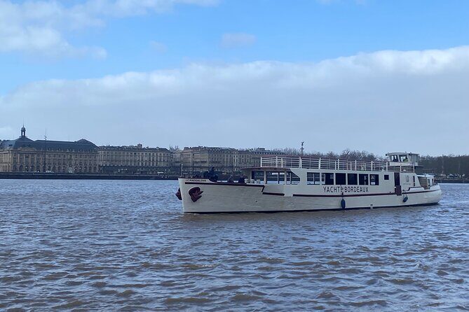 Prestige Commented Cruise glass of wine and Canelé in Bordeaux - What to Expect from the Bordeaux Yacht’s Guided Cruise