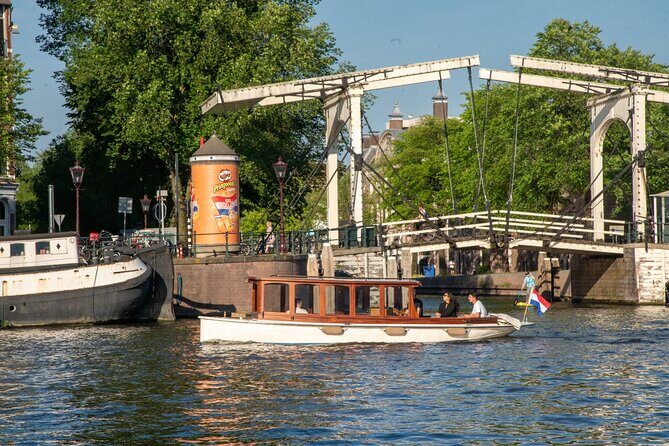 Private Boat Tour Amsterdam - 90 Min incl. welcome drink on historic saloon boat - A Closer Look at the Experience