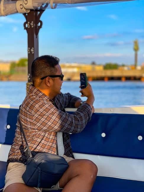 Riga: Canal Boat Sightseeing Tour With Audio guide - Audio guide on your phone: languages, headphones, and timing