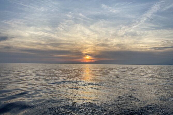 Sailing at sunset along the cliffs of Maro-Compartida - What to Expect on the Sunset Sailing Tour