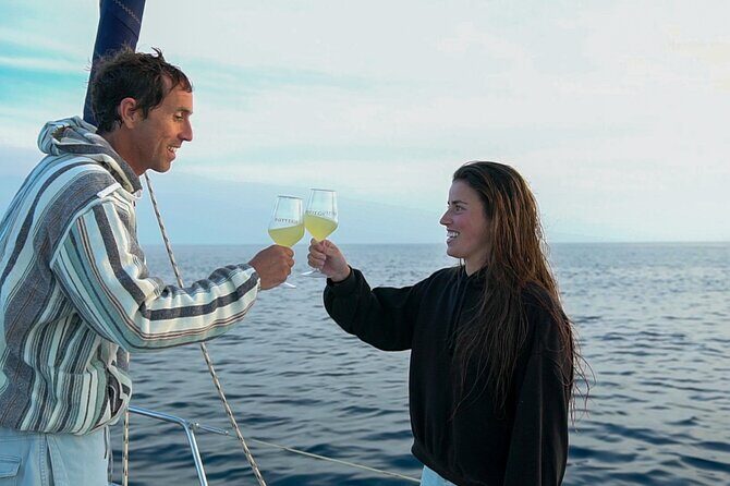 Sailing at sunset along the cliffs of Maro-Compartida - The Practical Side: Cost, Timing, and Group Size