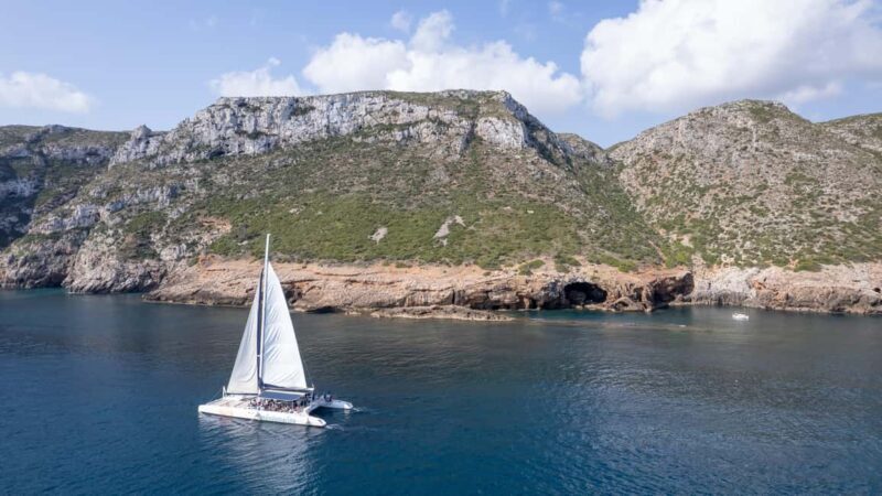 Sailing catamaran ride through Cova Tallada and optional swim stop - The Experience: What You Can Expect on the Water