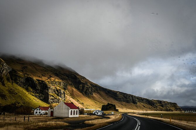 South Coast, Waterfalls and Black Sand Beach (Small Group Tour) - Stop 3: Vik and a Quick Church View Over the Coastline