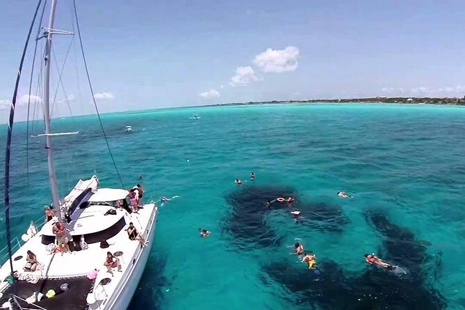 Top Tour Sail To Isla Mujeres By Catamaran Buffet And Drinks Included - Key Points
