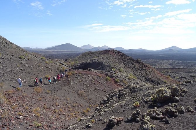Volcano Trekking Tour (Timanfaya eruptions) - Equipment and weather support: walking poles and rain jackets
