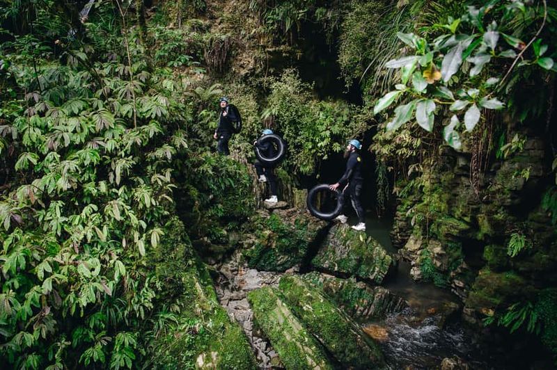 Waitomo Caves: Labyrinth Black Water Rafting Experience - Waterfall jumps and scrambling: where the adventure gets physical