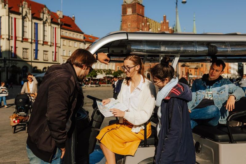 Wroclaw: E-Car Tour and Audio Guide - Seating, headphones, and the practical hearing stuff